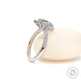 Bridal halo ring with pave shank and pear moissanite