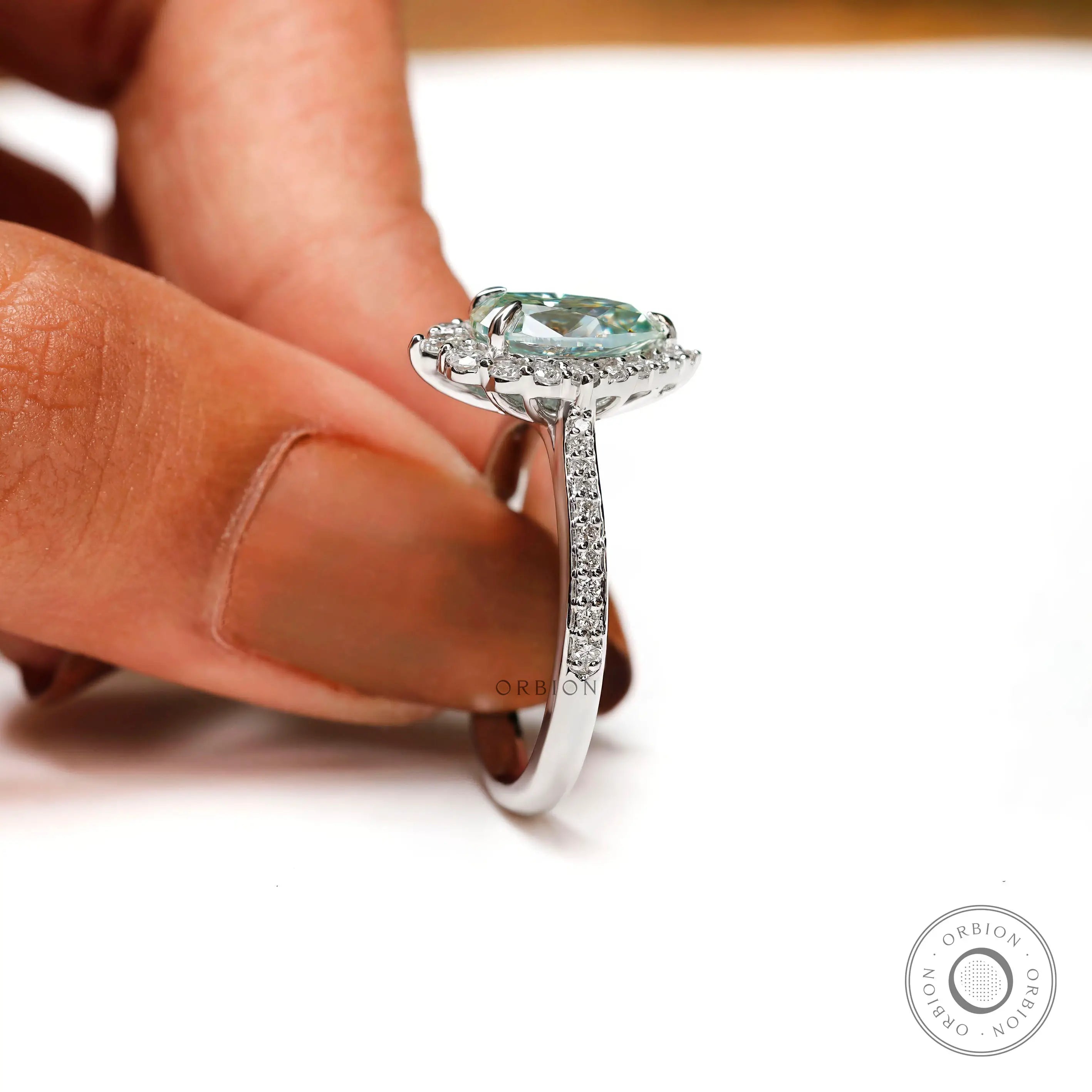 White gold engagement ring with pear center stone