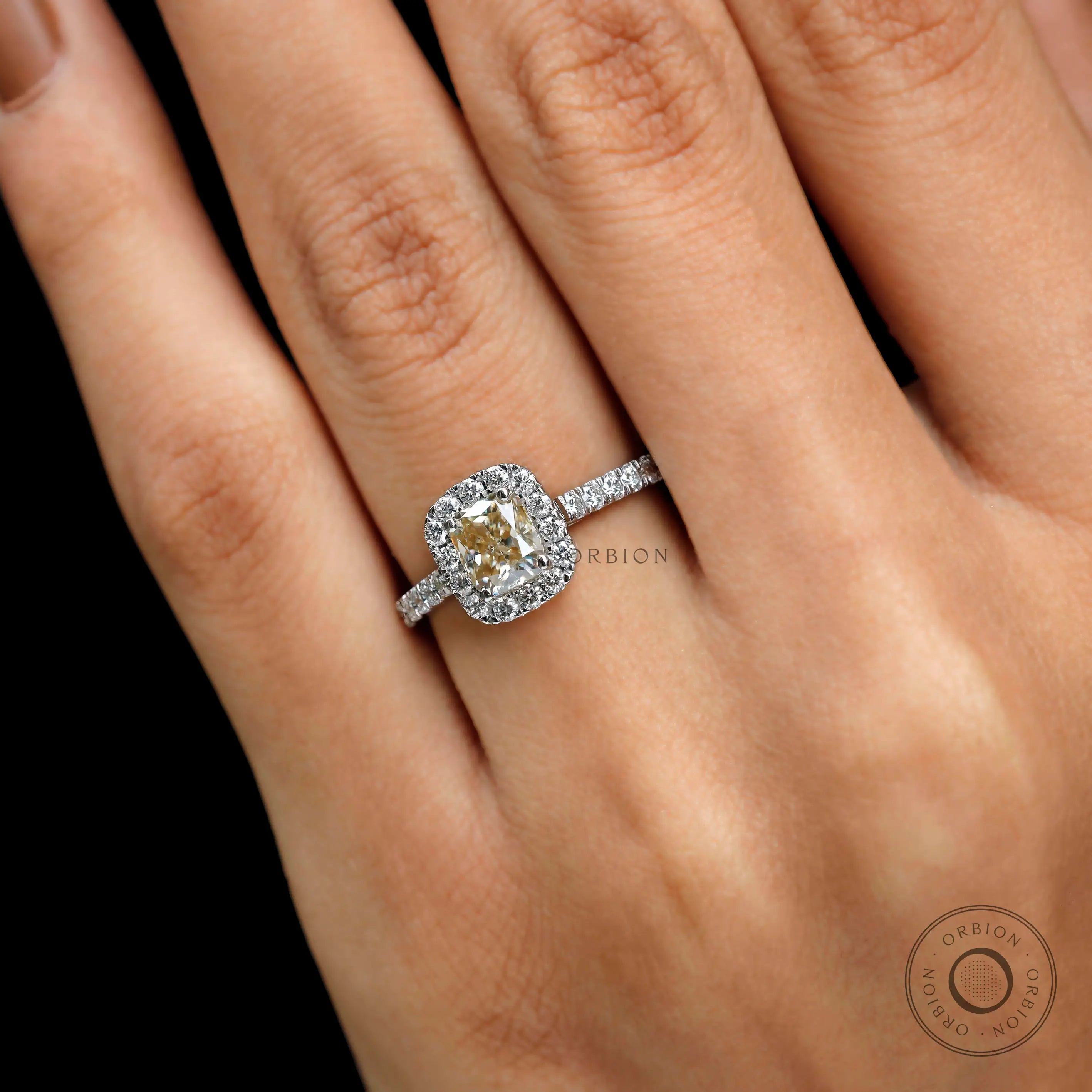 Cushion cut champagne moissanite ring close up halo setting
