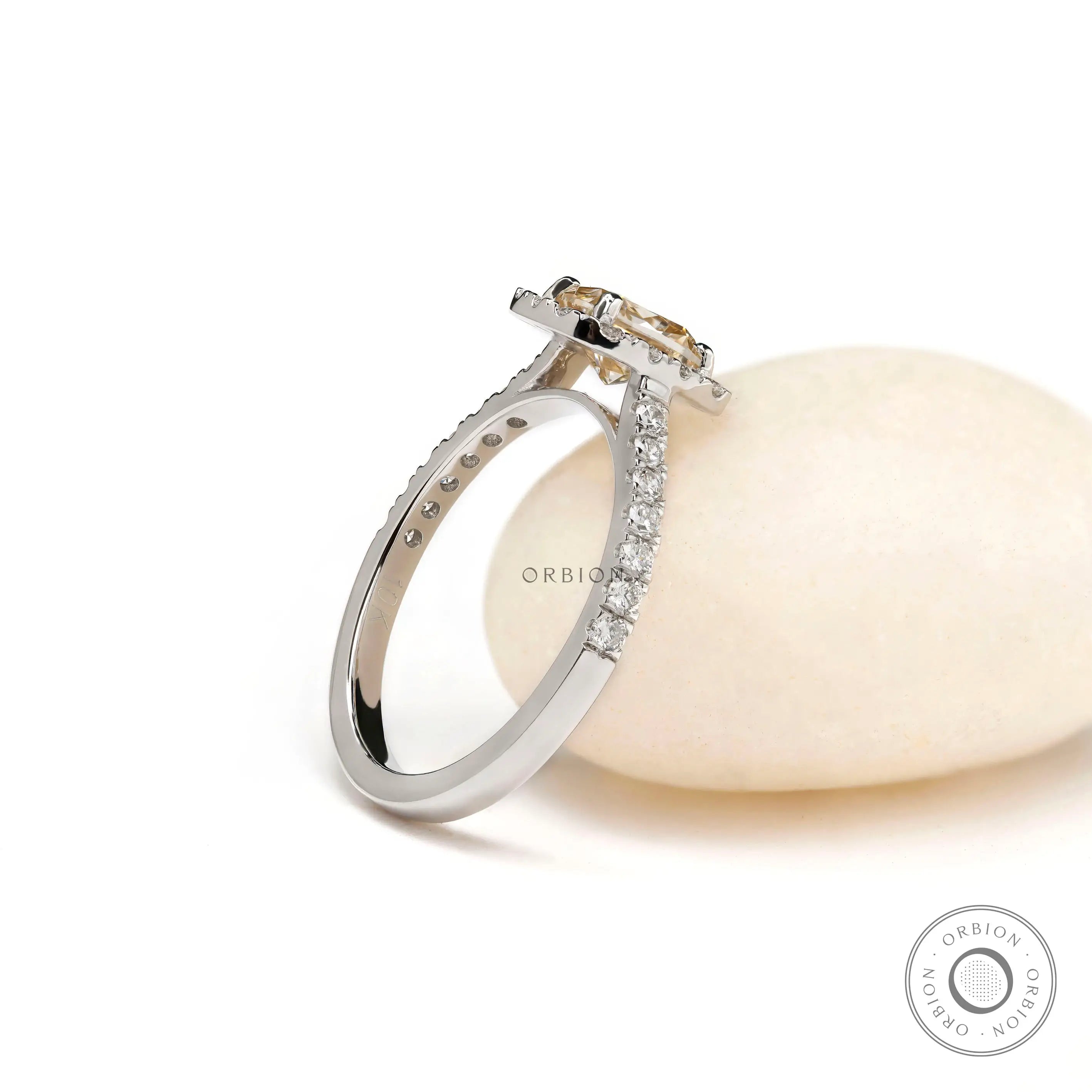 Halo engagement ring with pave shank cathedral white gold angle view