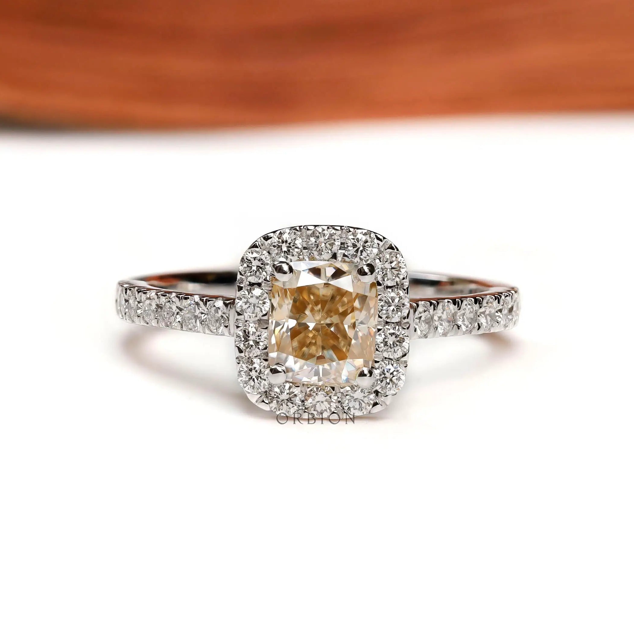 Cushion cut yellowish champagne moissanite halo engagement ring white gold