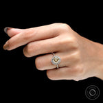 Fine jewelry halo ring on fingure with brilliant cut moissanite