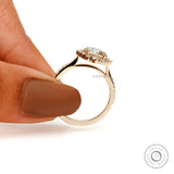 Classic yellow gold cathedral engagement ring with diamond halo front view
