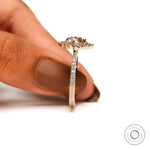 Round brilliant moissanite halo ring with pave diamond shank