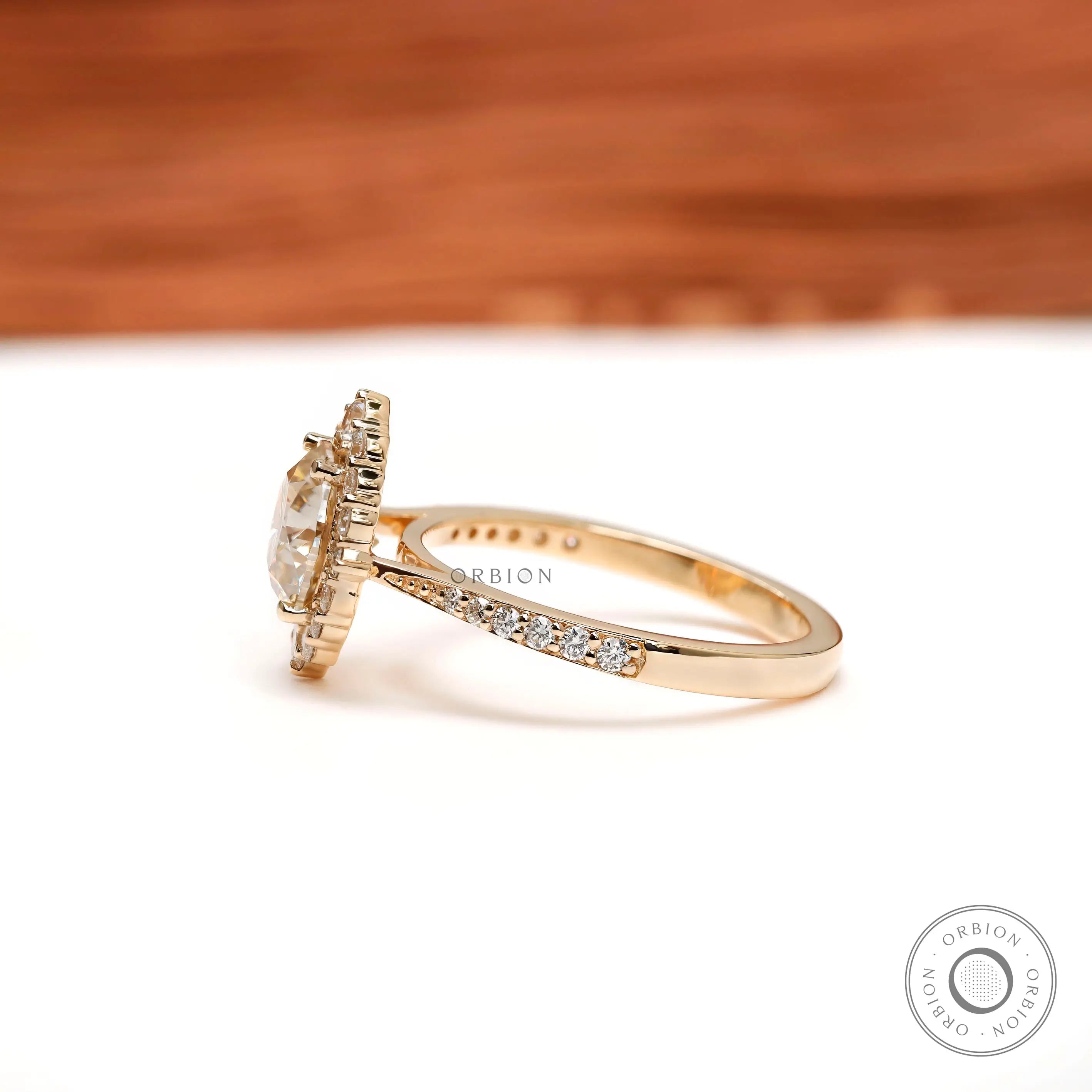 Pave shank moissanite engagement ring in yellow gold