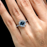 Close up of dark grey moissanite halo and pave setting
