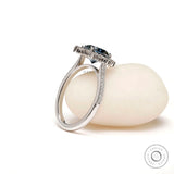 Elegant halo cathedral engagement ring with pave band