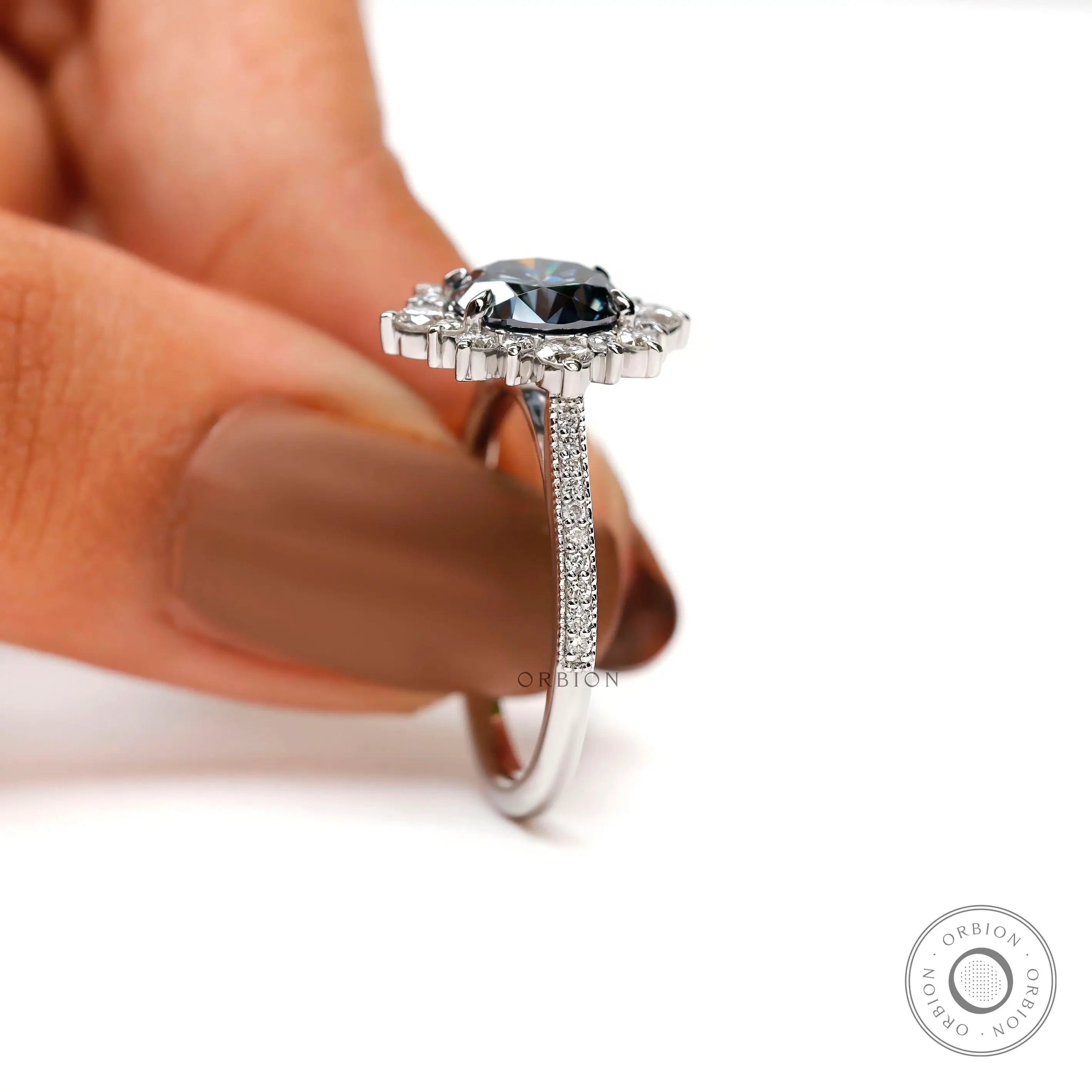 Side angle of halo engagement ring with pave diamonds