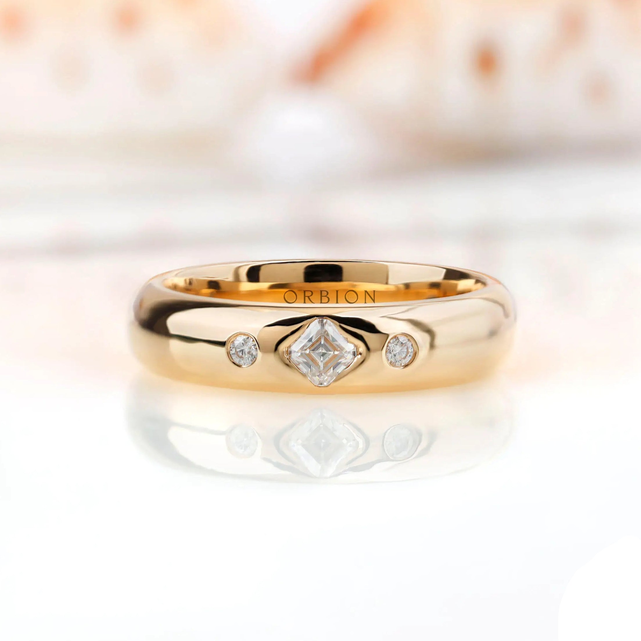 Flush set Asscher cut moissanite wedding band front view on reflective surface