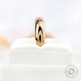 Vertical standing view of flush set Asscher cut moissanite wedding band