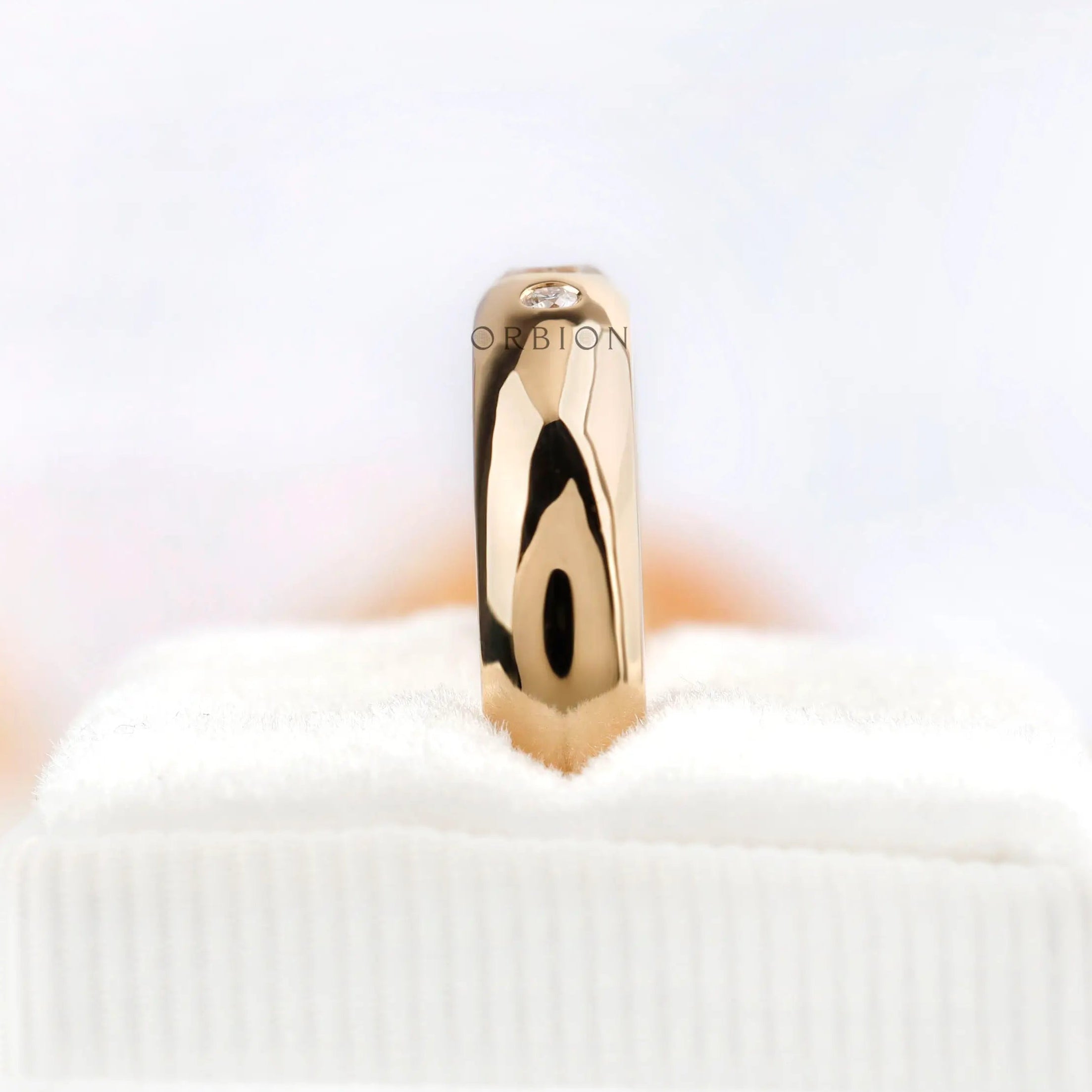 Vertical standing view of flush set Asscher cut moissanite wedding band
