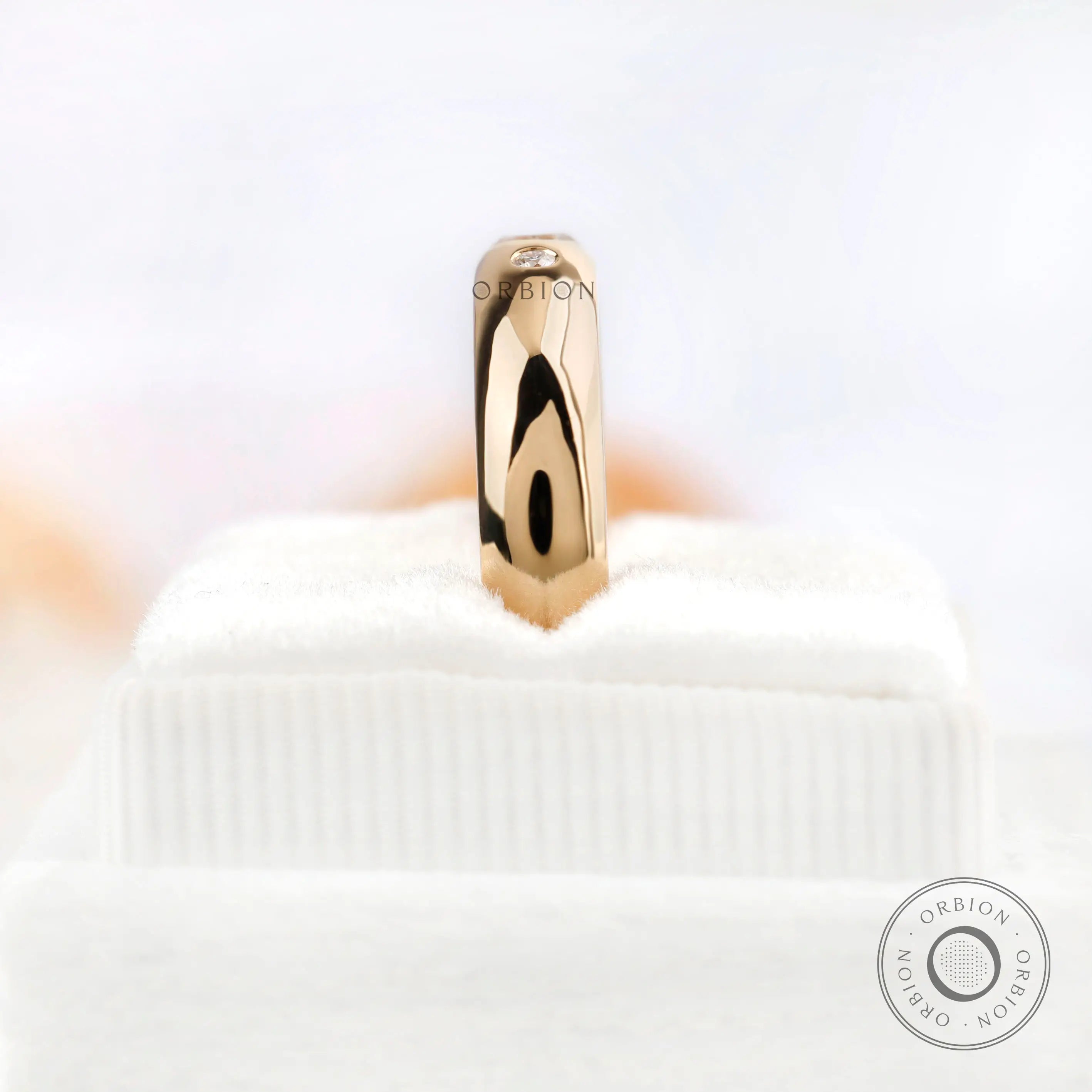 Vertical standing view of flush set Asscher cut moissanite wedding band