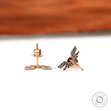 Minimal angel wing stud earrings with black moissanite detailing