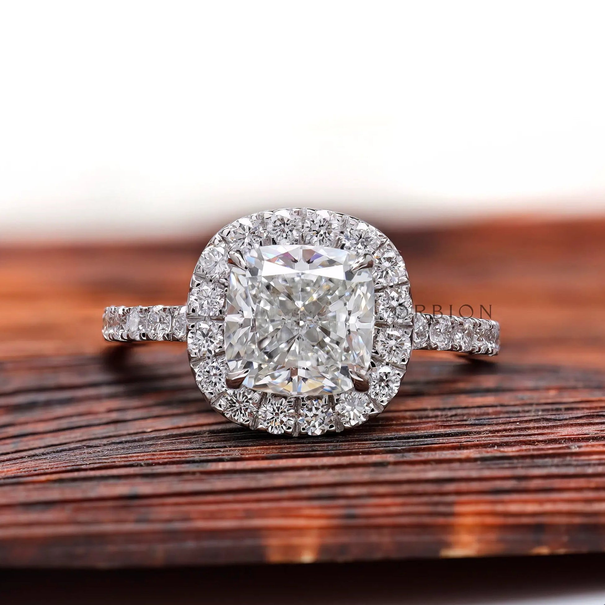 Cushion cut lab grown diamond cluster halo ring in 18K white gold, front view
