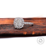 Cushion cluster halo engagement ring with pavé band, angled view