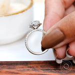 Pavé band detail of cushion cluster halo ring in white gold