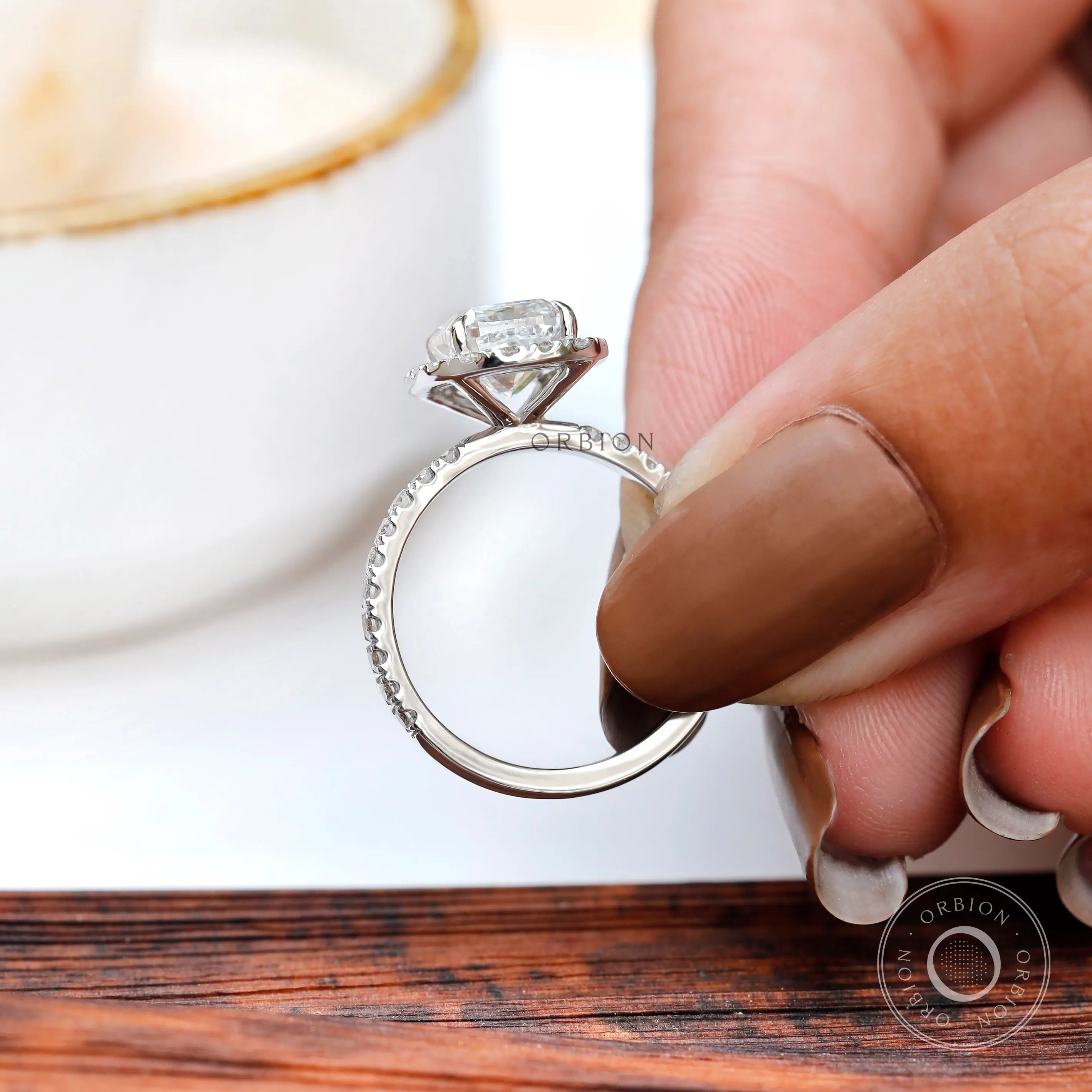 Pavé band detail of cushion cluster halo ring in white gold