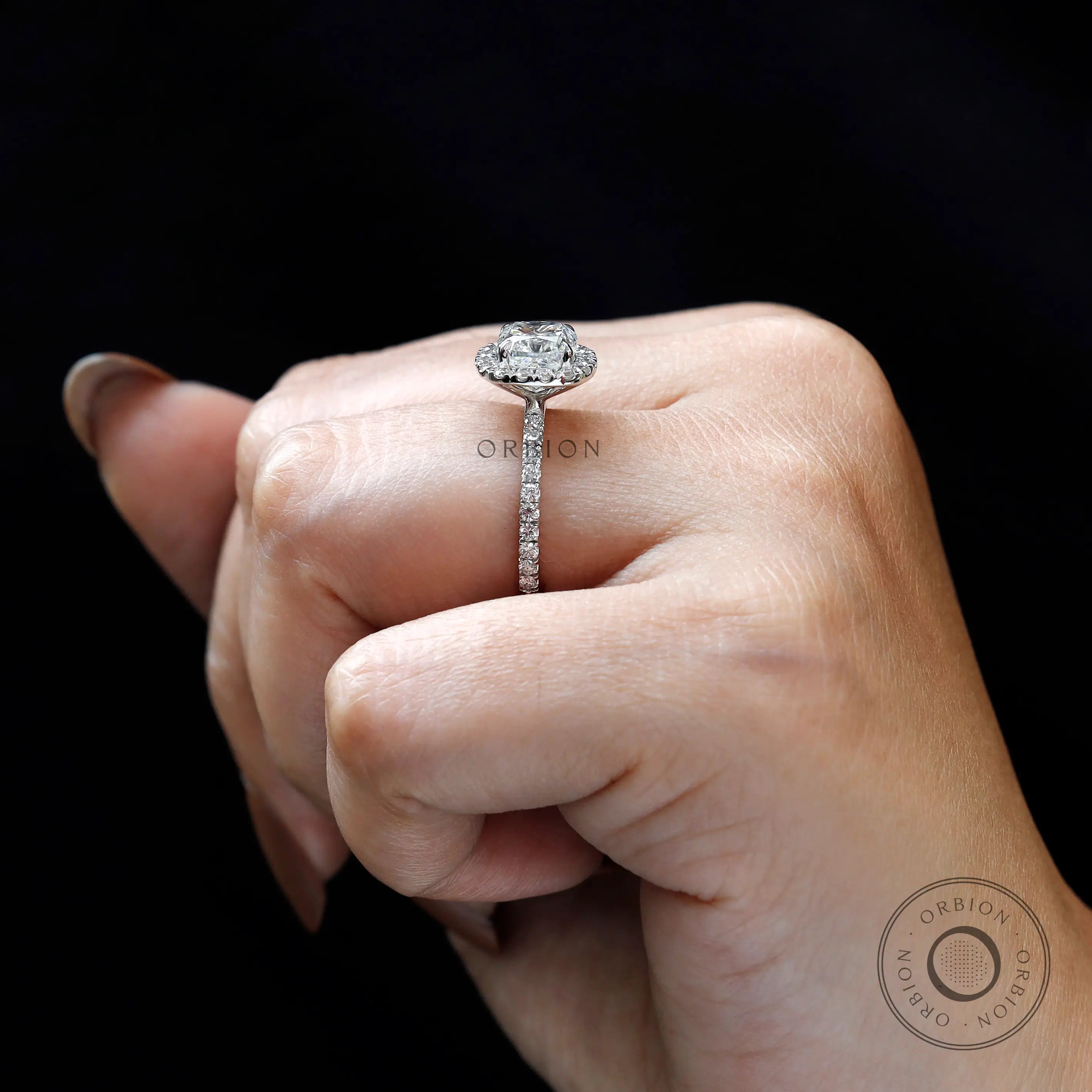 On-hand side view showing raised cluster halo setting