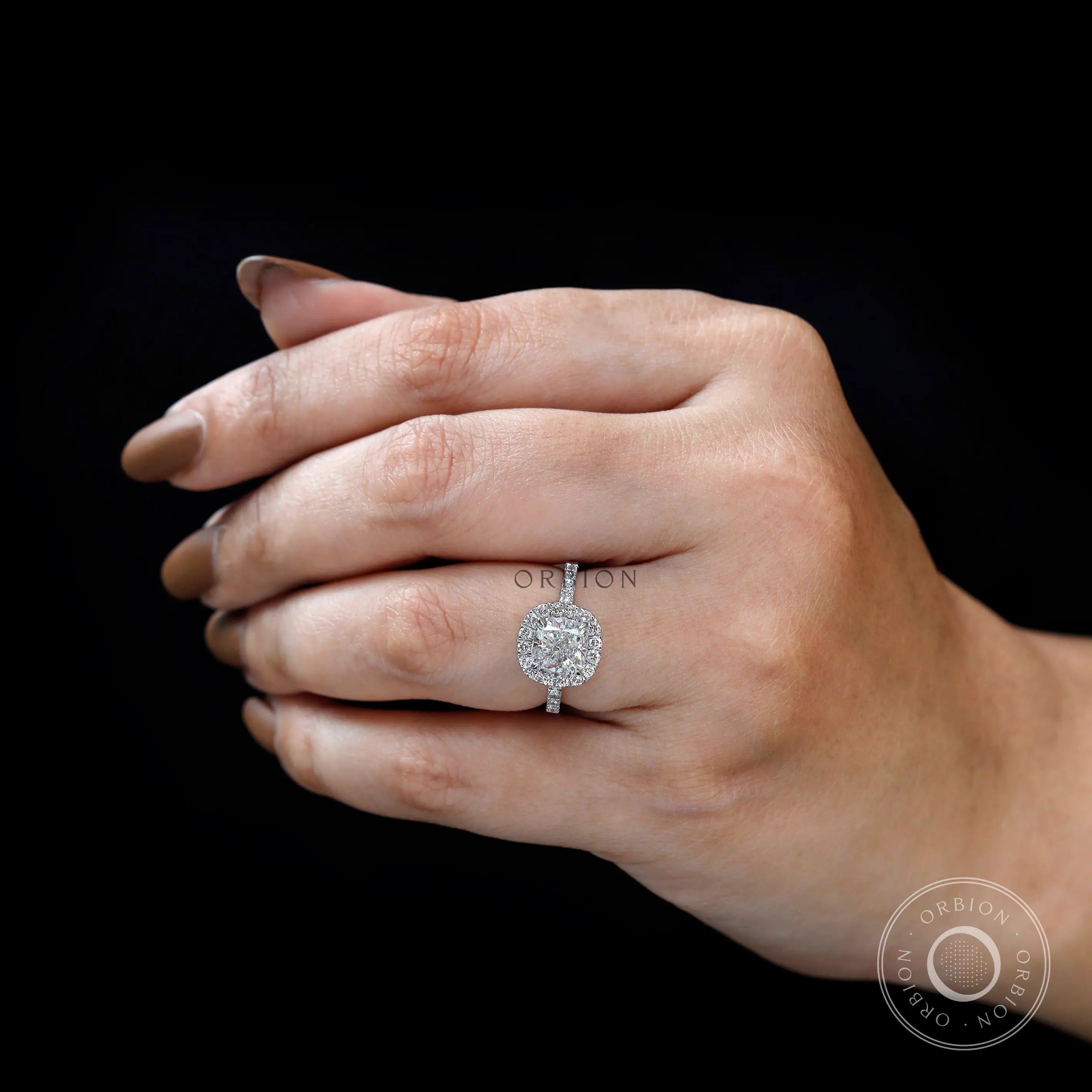 Top view of cushion cluster halo engagement ring