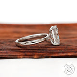 Side profile of radiant diamond solitaire ring showing prong setting