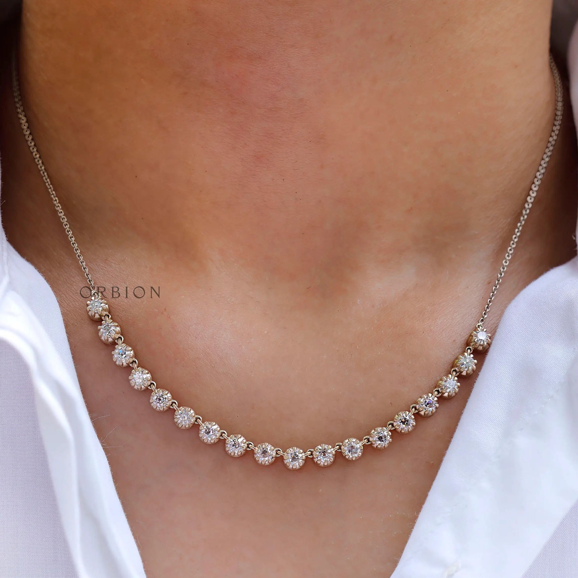 Necklace worn on neck showing layered statement styling