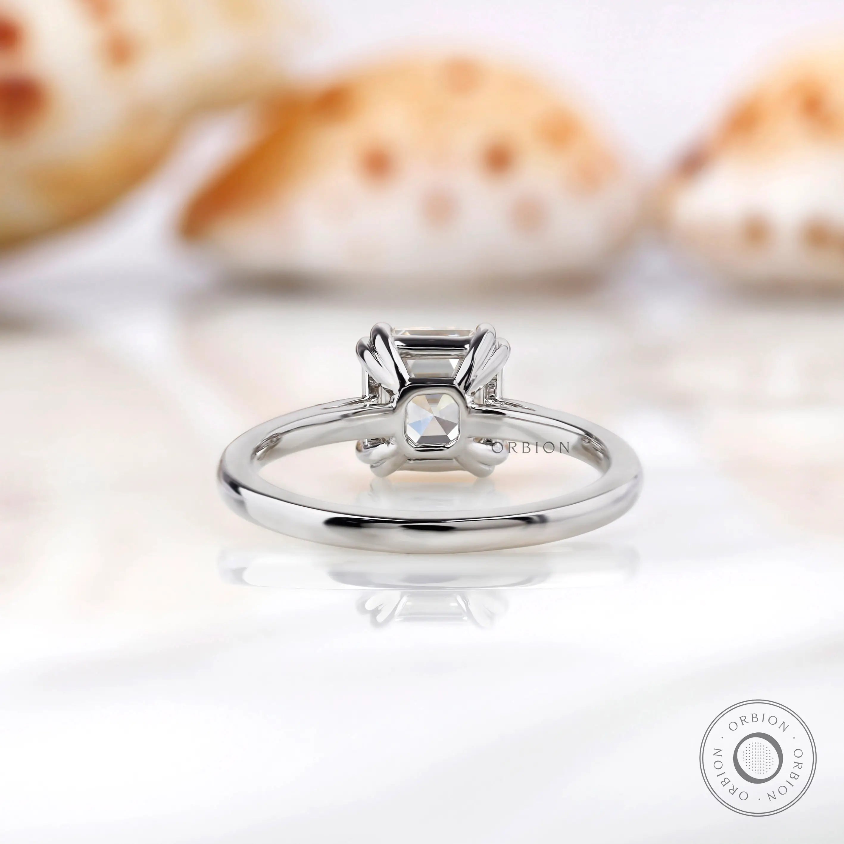 Close-up view of Asscher cut Moissanite solitaire ring with prong setting