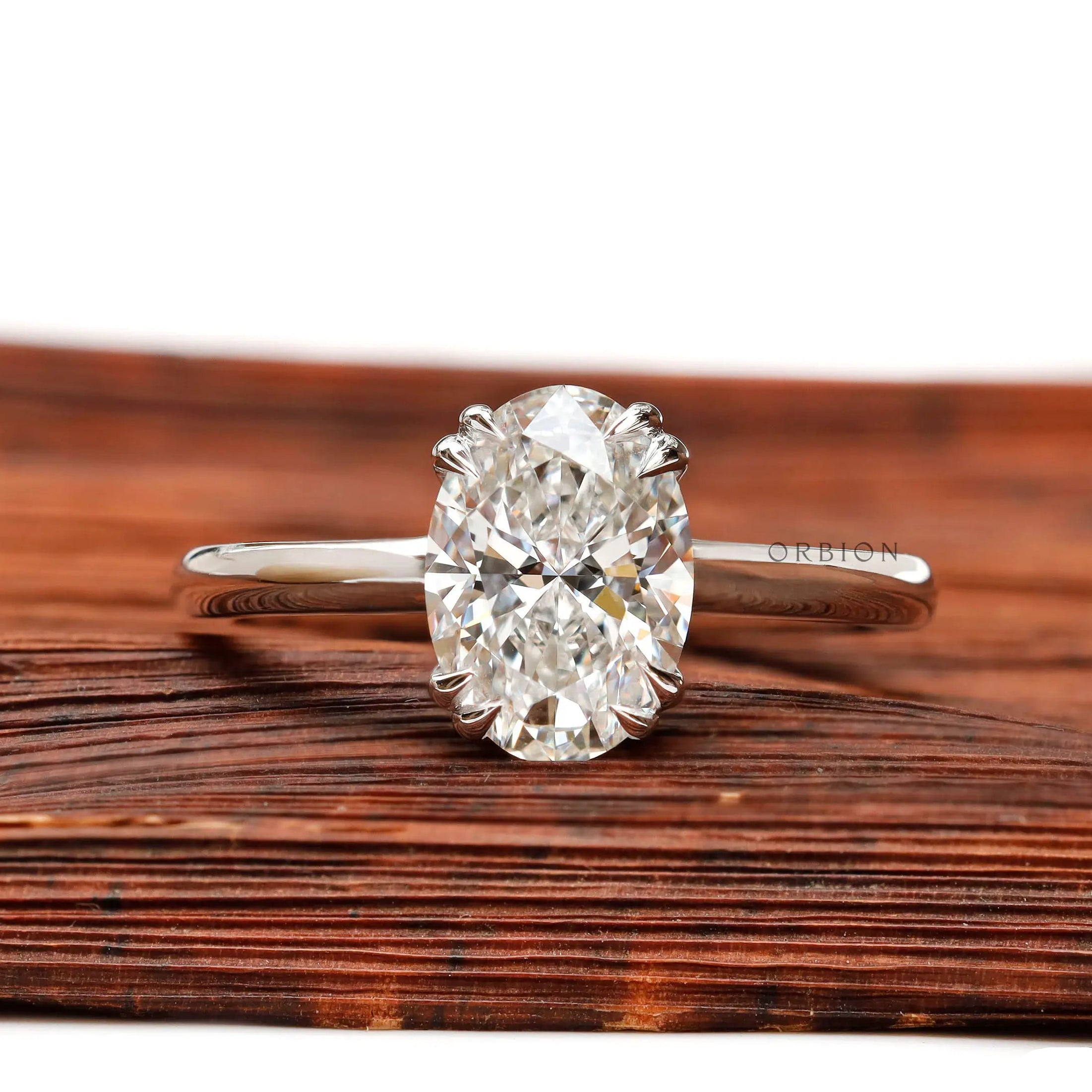 Oval lab grown diamond solitaire ring in 14K white gold