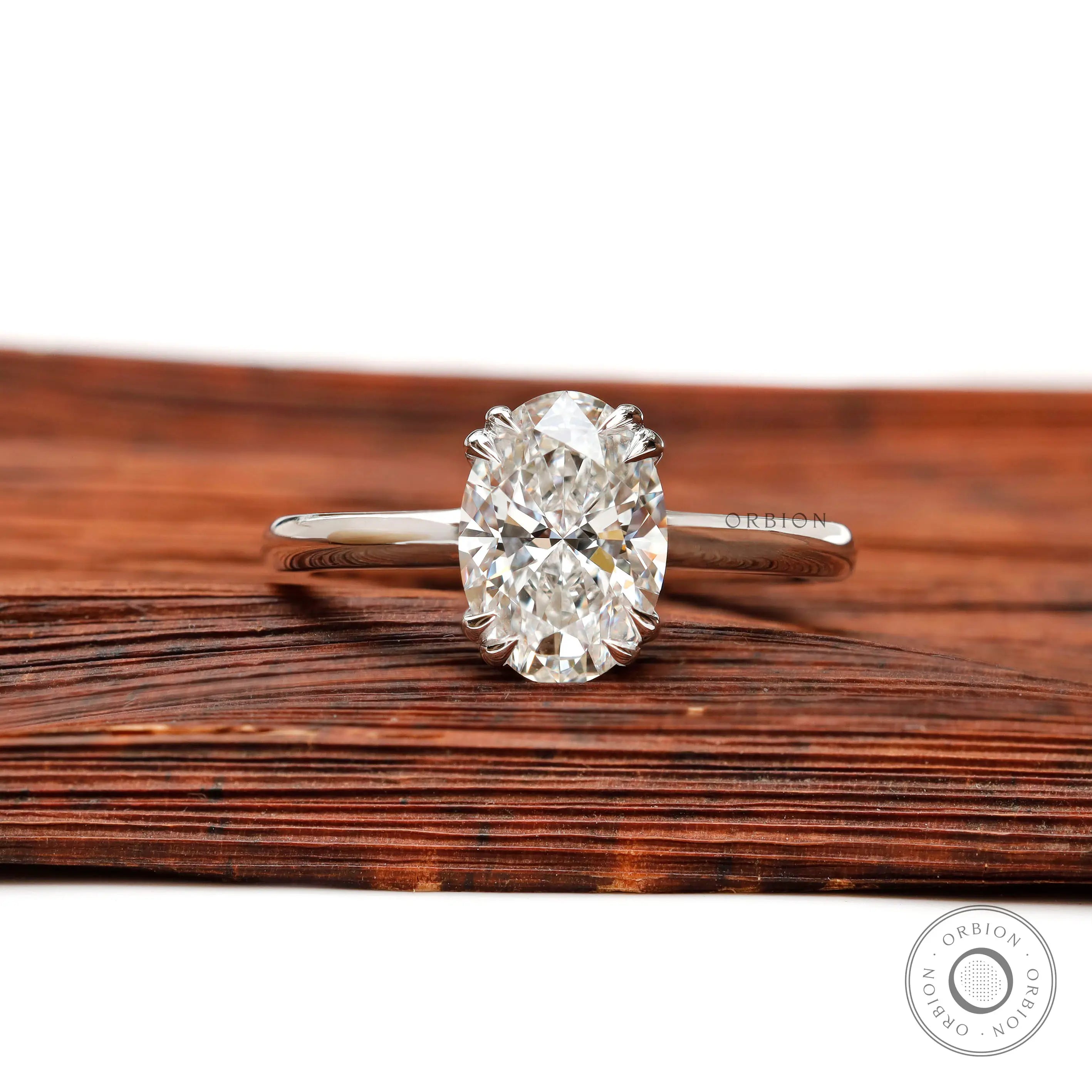 Oval lab grown diamond solitaire ring in 14K white gold