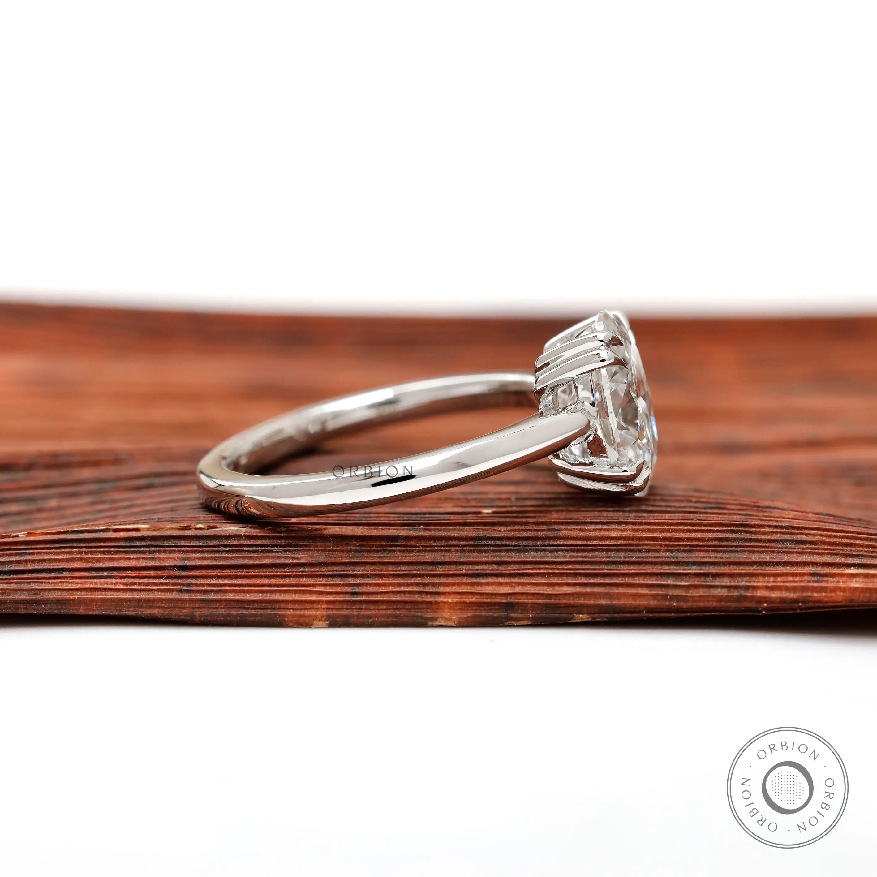 Side profile of oval diamond ring in white gold
