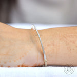 Lab grown diamond bangle bracelet laid flat showing sleek profile