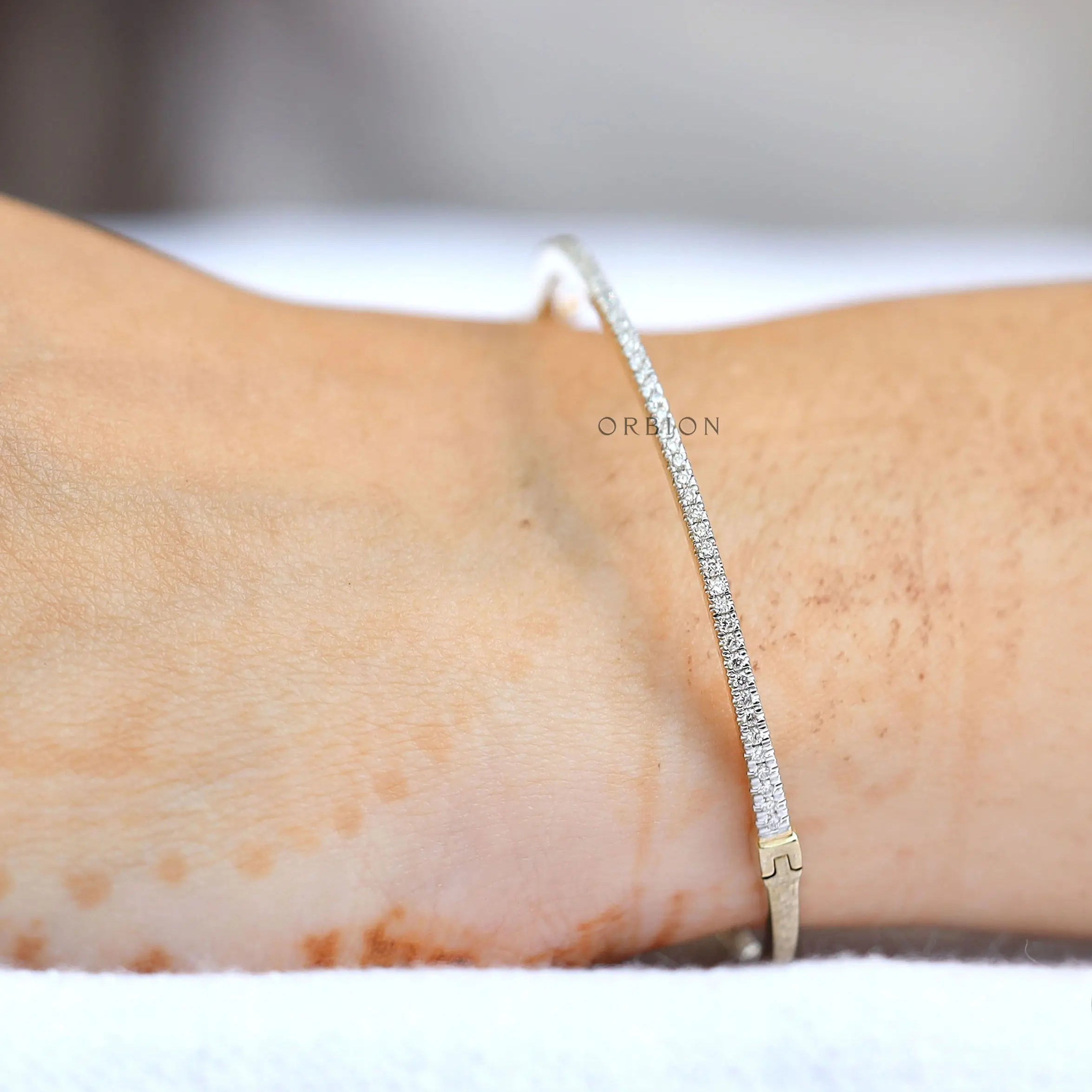 Lab grown diamond bangle bracelet laid flat showing sleek profile