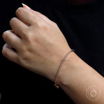 Everyday wear lab grown diamond bangle bracelet styled on wrist