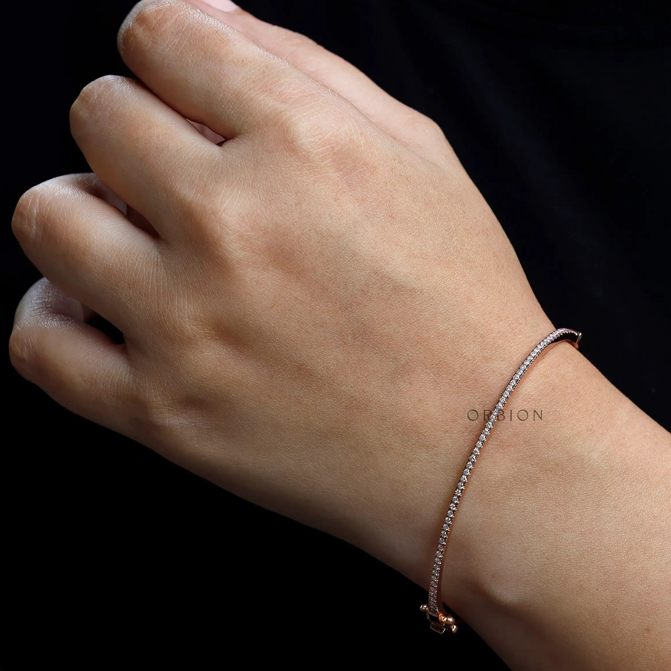 Everyday wear lab grown diamond bangle bracelet styled on wrist