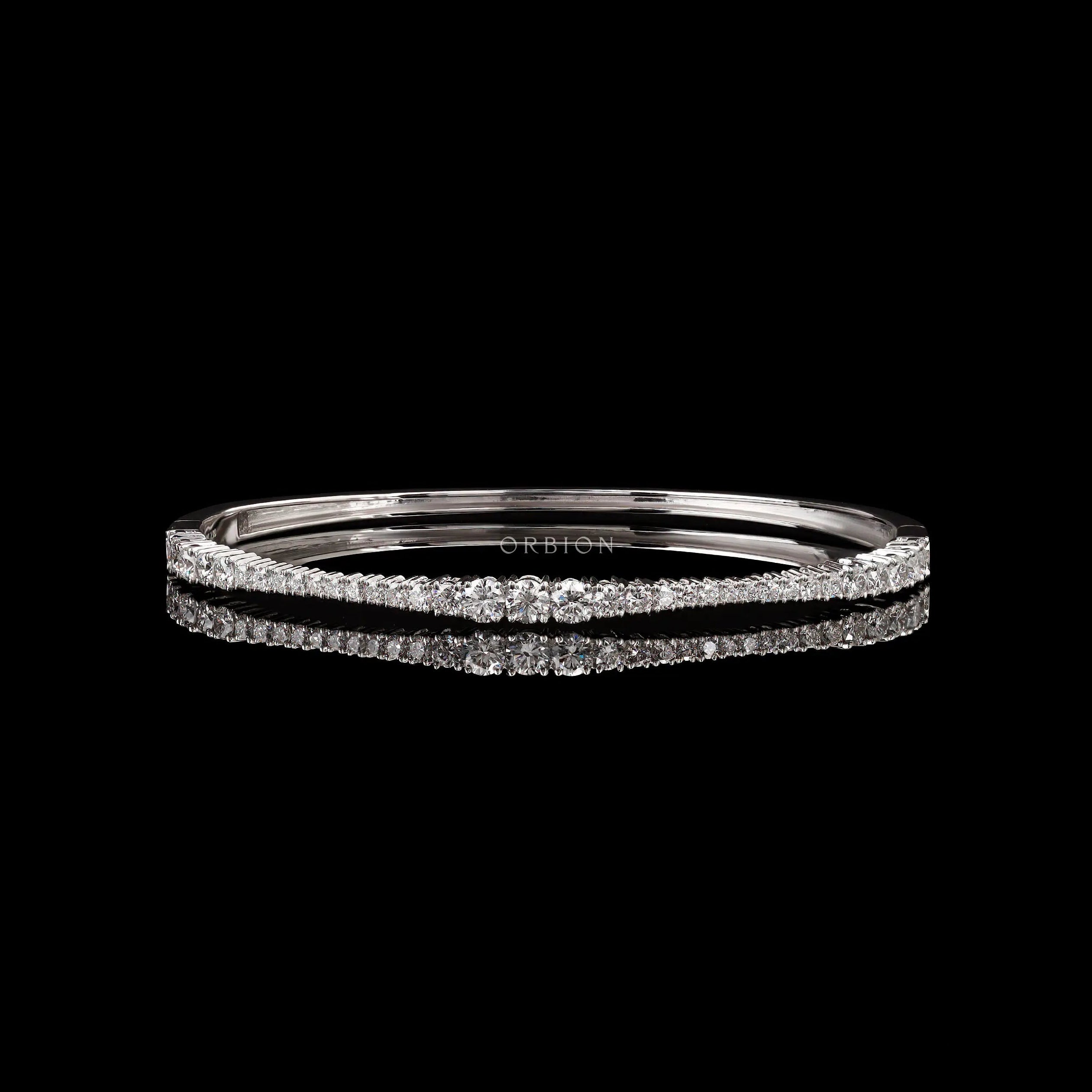 Graduating lab grown diamond bangle bracelet front view on black background
