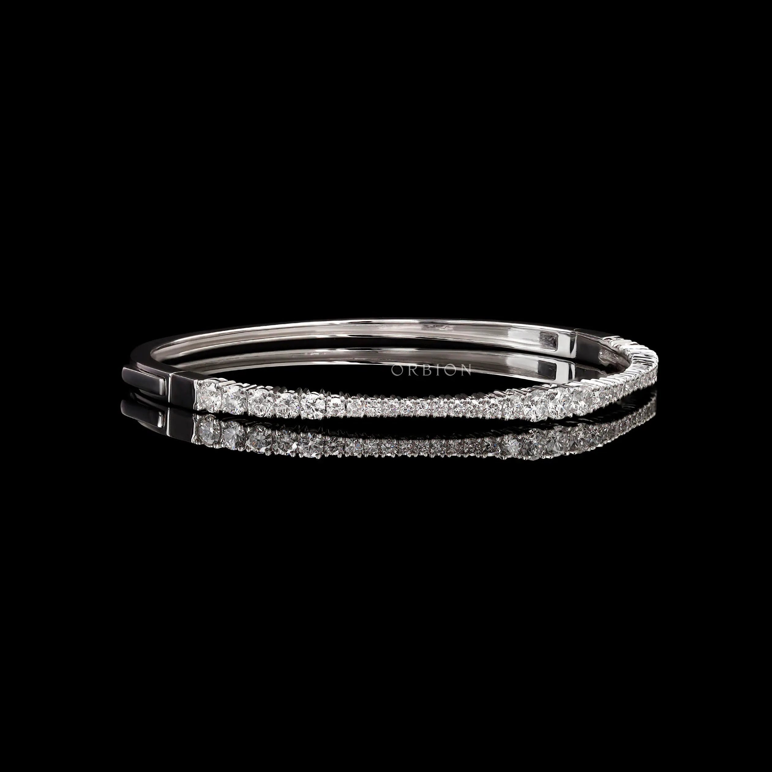 Angled side view of solid gold diamond bangle bracelet showing seamless lock