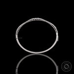 Top view of graduating lab grown diamond bangle bracelet highlighting diamond layout
