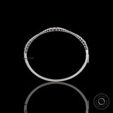 Top view of graduating lab grown diamond bangle bracelet highlighting diamond layout