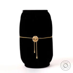 Back view of solid gold bolo bracelet highlighting adjustable chain ends