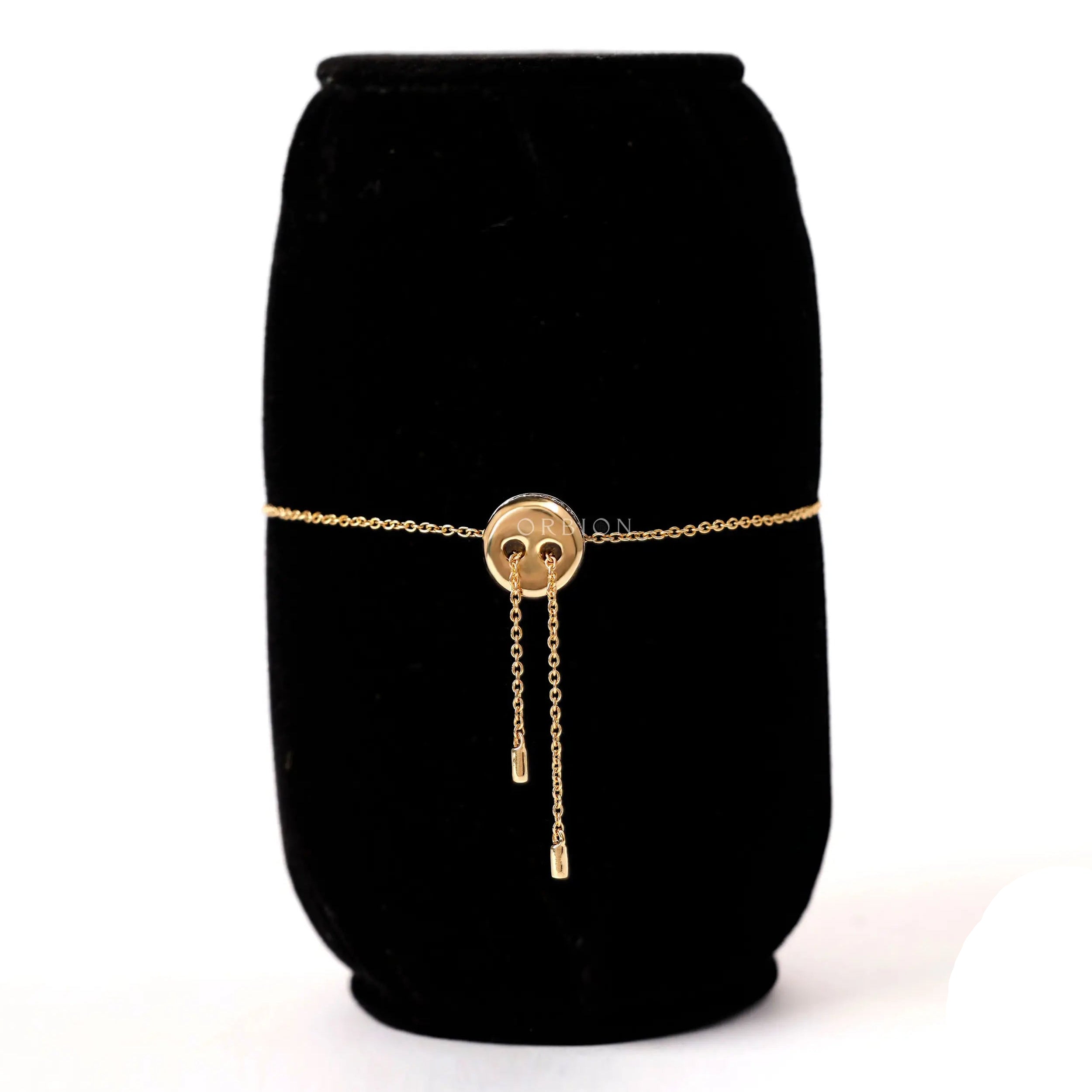 Back view of solid gold bolo bracelet highlighting adjustable chain ends