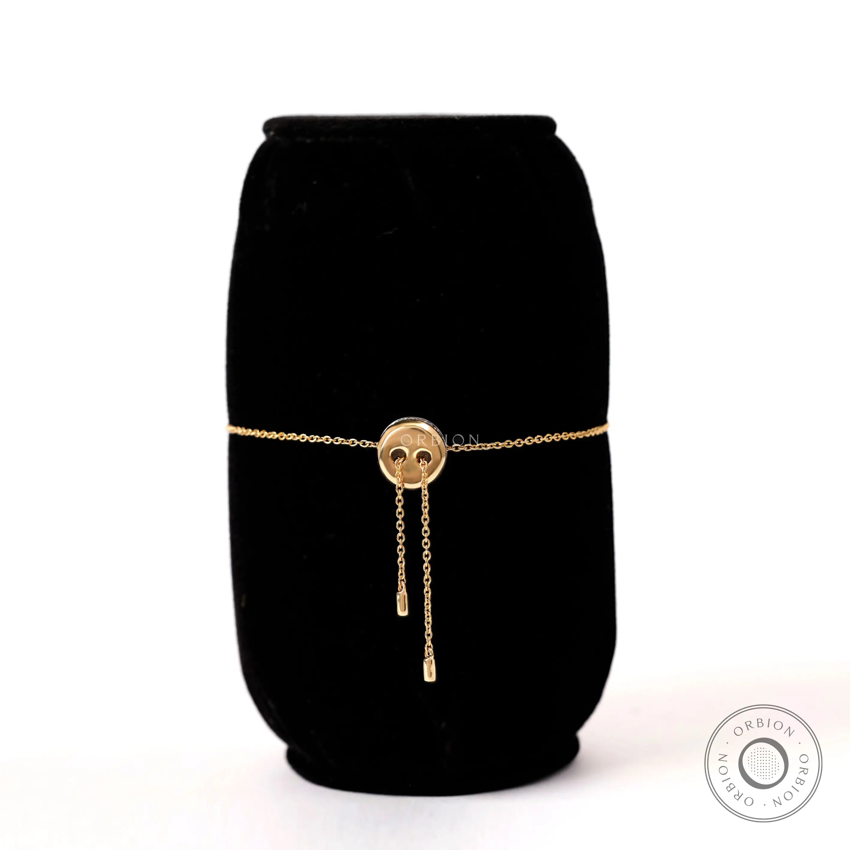 Back view of solid gold bolo bracelet highlighting adjustable chain ends