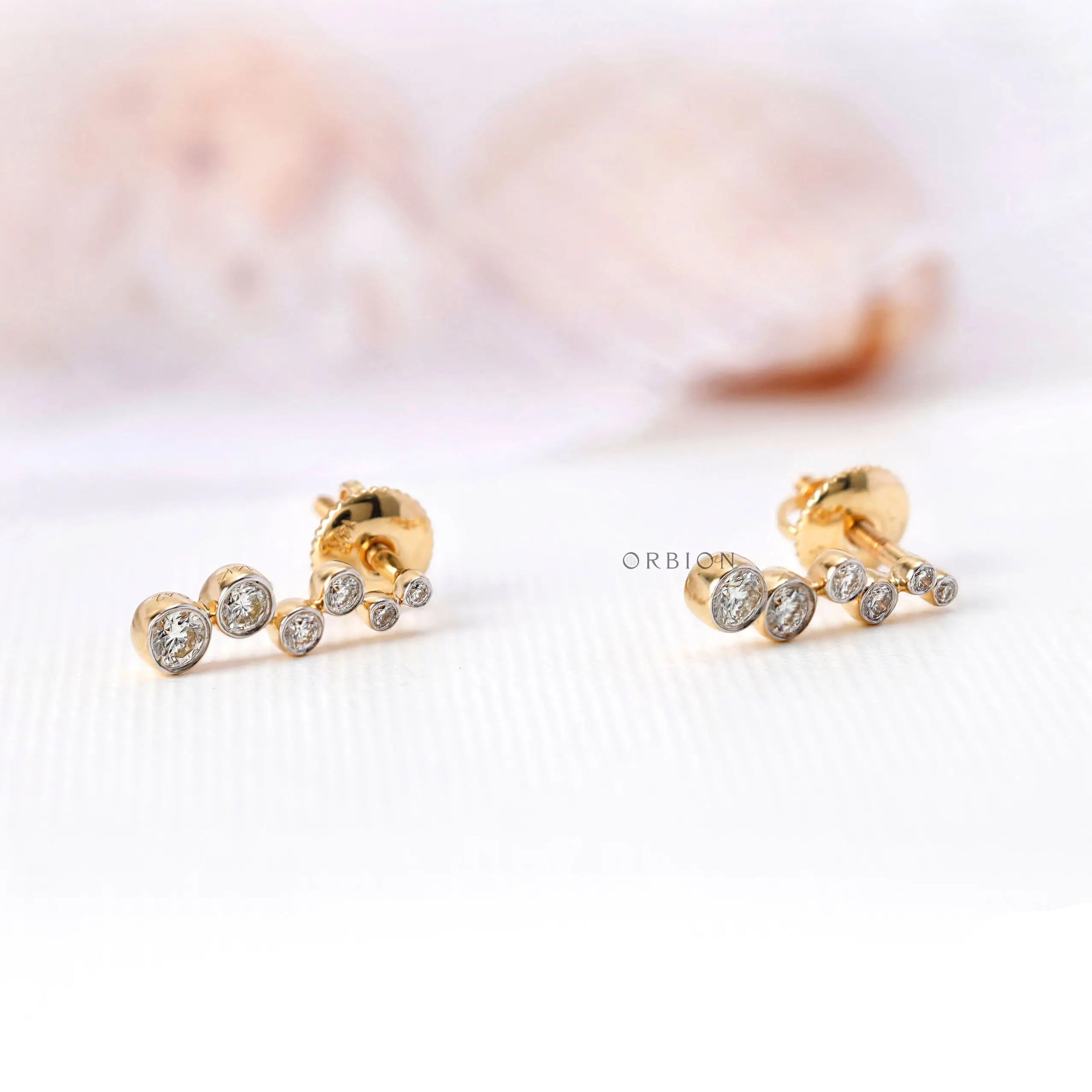 Graduated lab grown diamond drop stud earrings