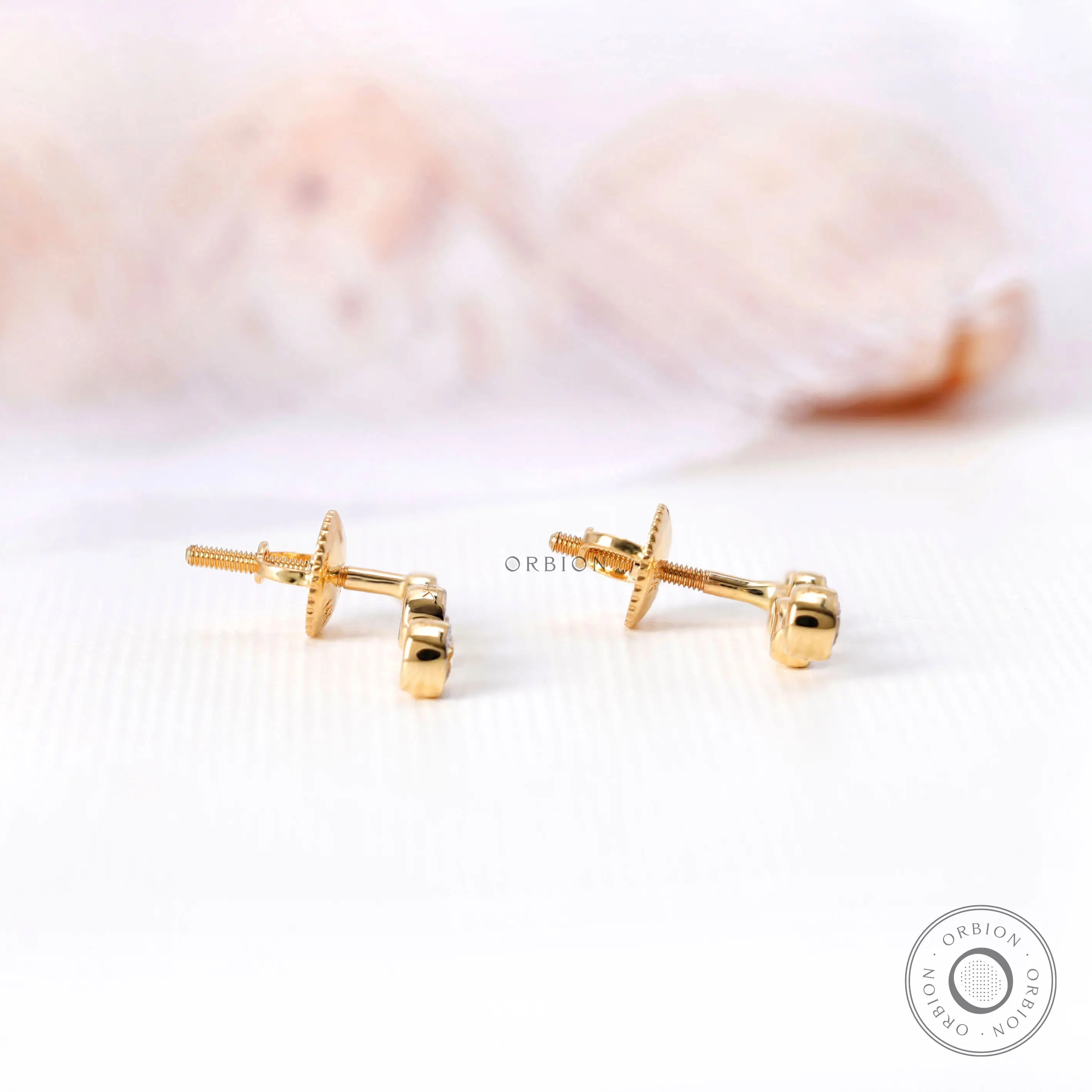 Diamond journey earrings graduated bezel set diamonds