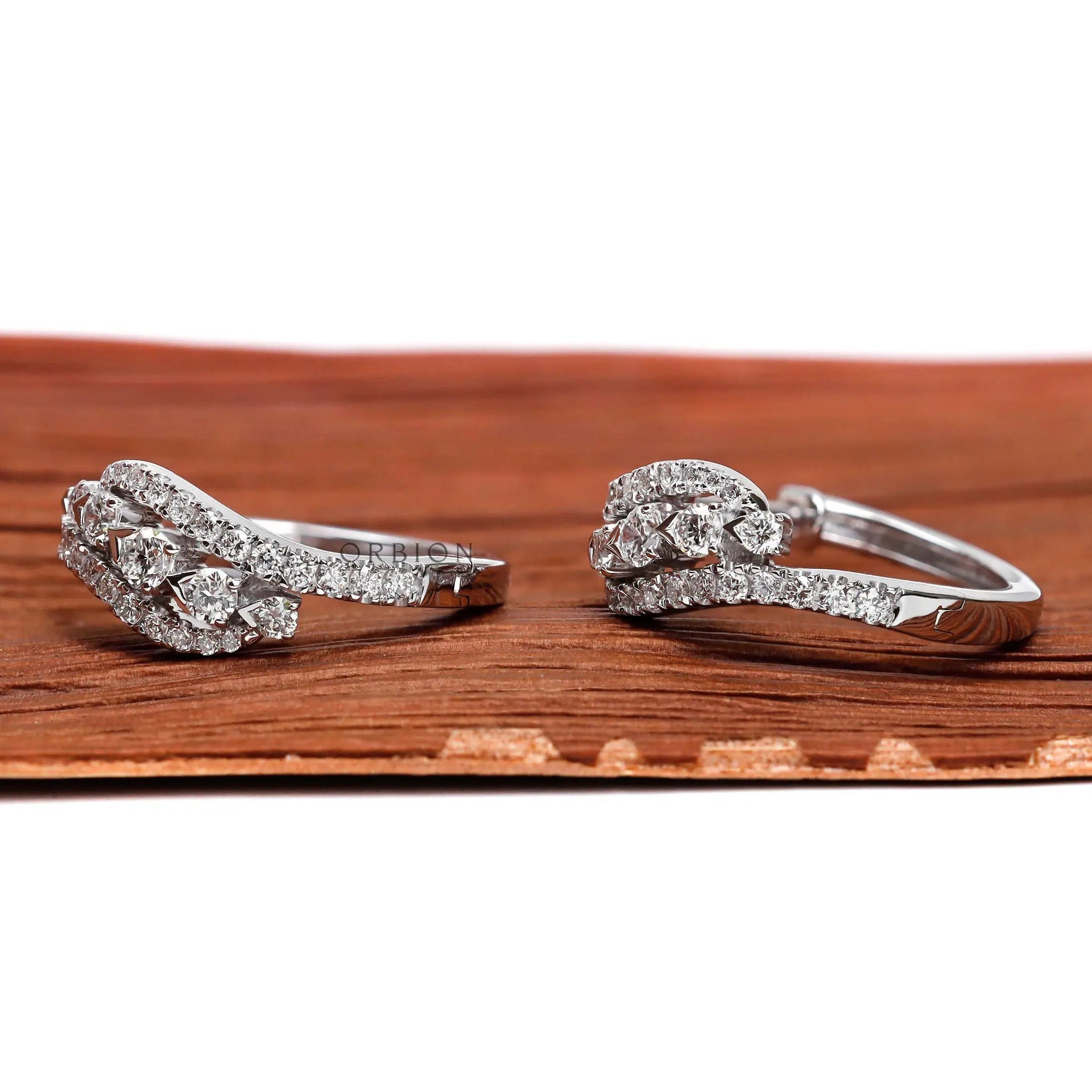 Close up of brilliant cut lab grown diamond cluster earrings