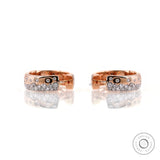 Rose gold huggie hoop earrings with scattered lab diamonds