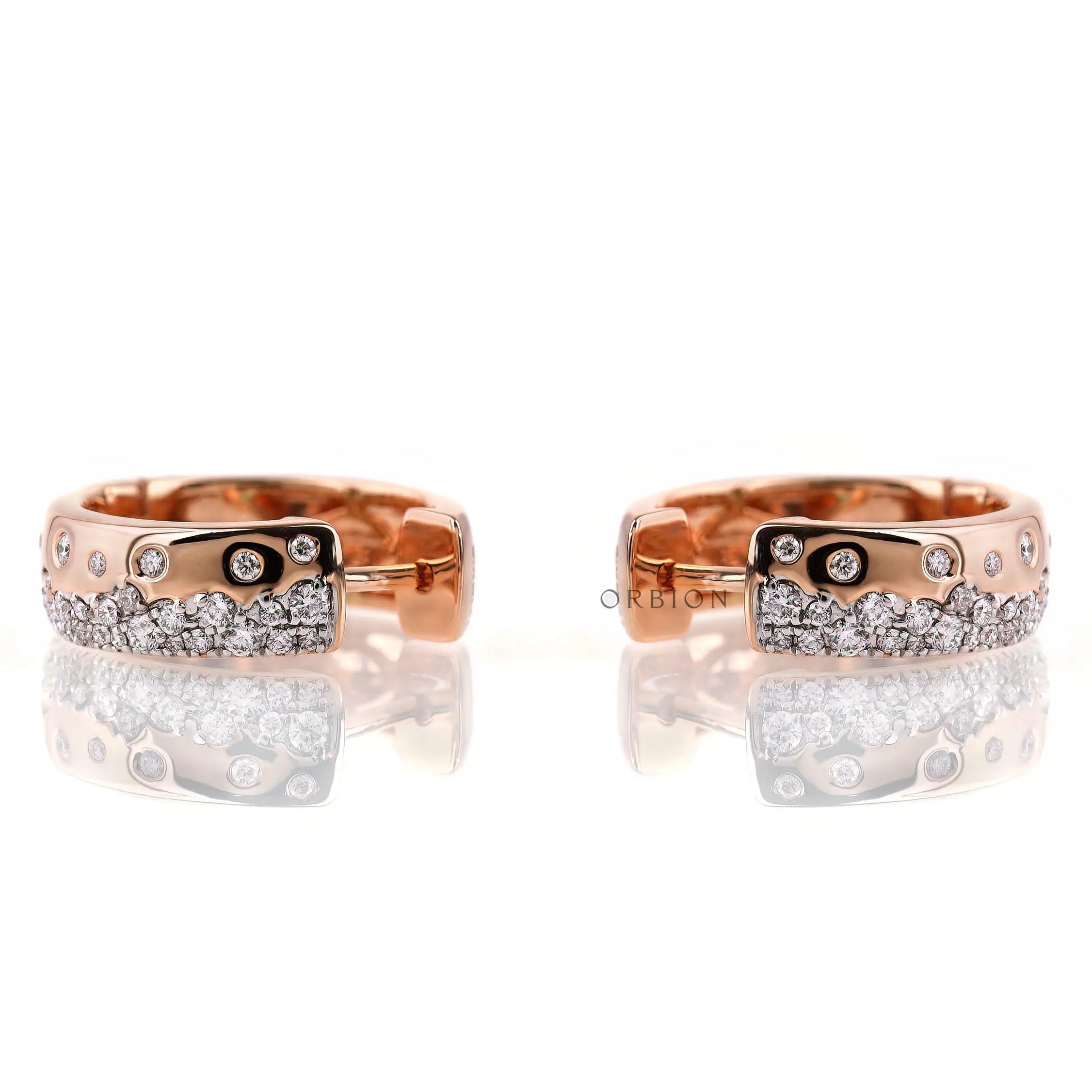 Rose gold huggie hoop earrings with scattered lab diamonds