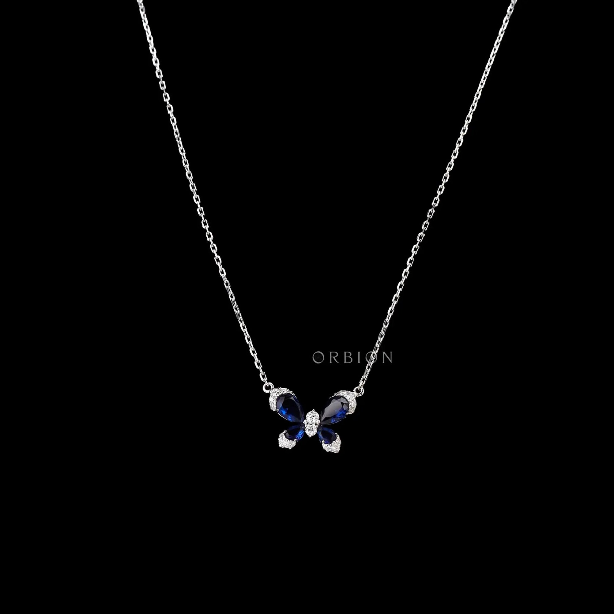Butterfly necklace with lab diamonds and blue sapphire wings in white gold