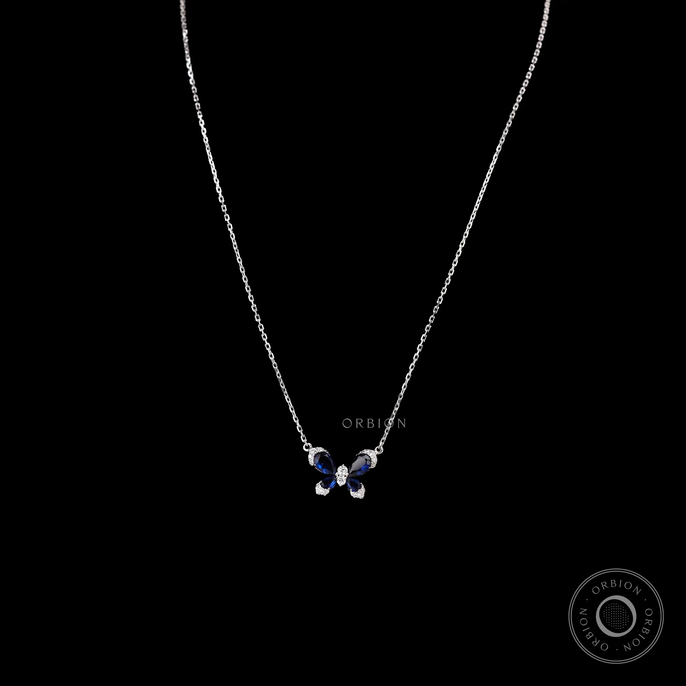 Butterfly necklace with lab diamonds and blue sapphire wings in white gold