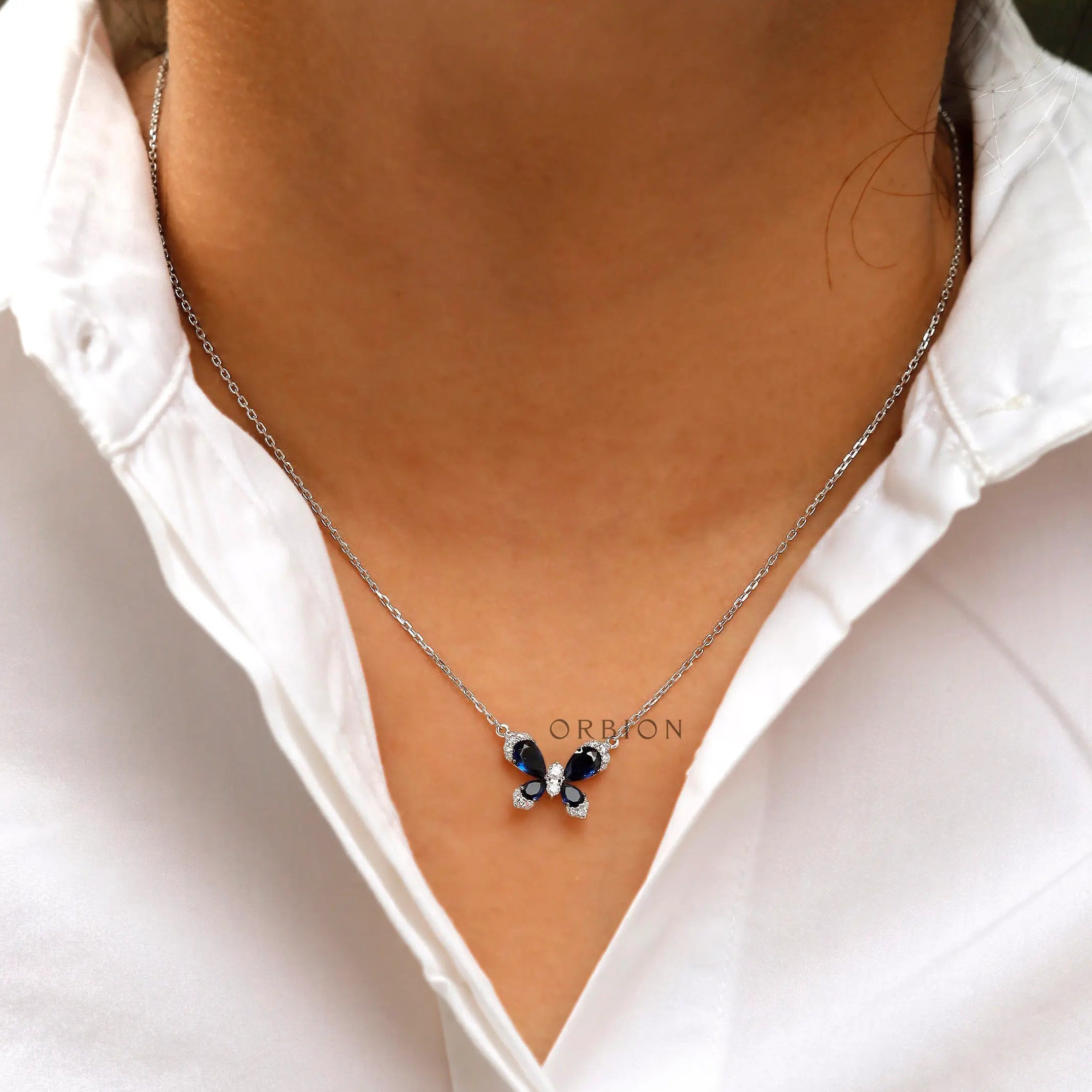 White gold butterfly necklace elegant design close up