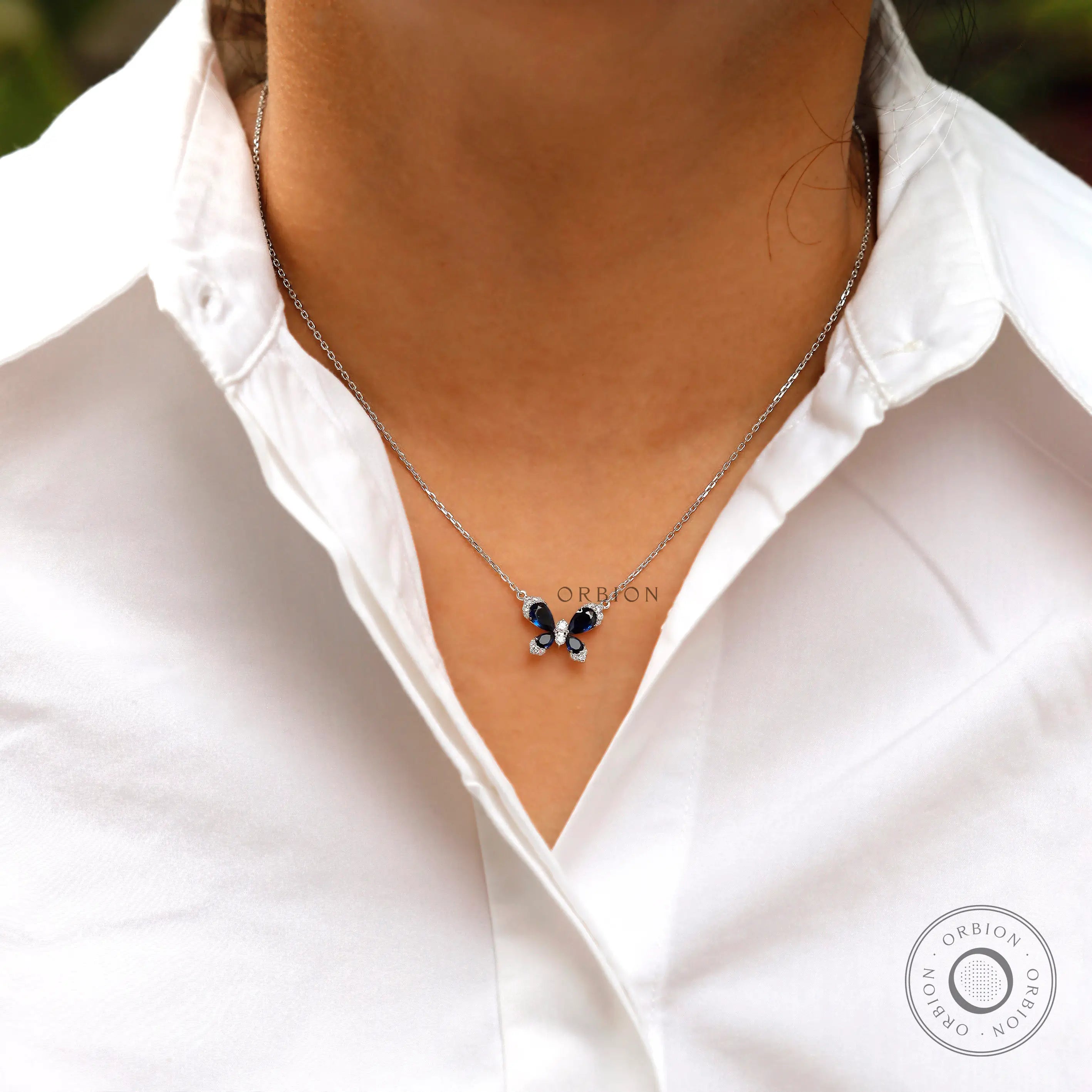 White gold butterfly necklace elegant design close up