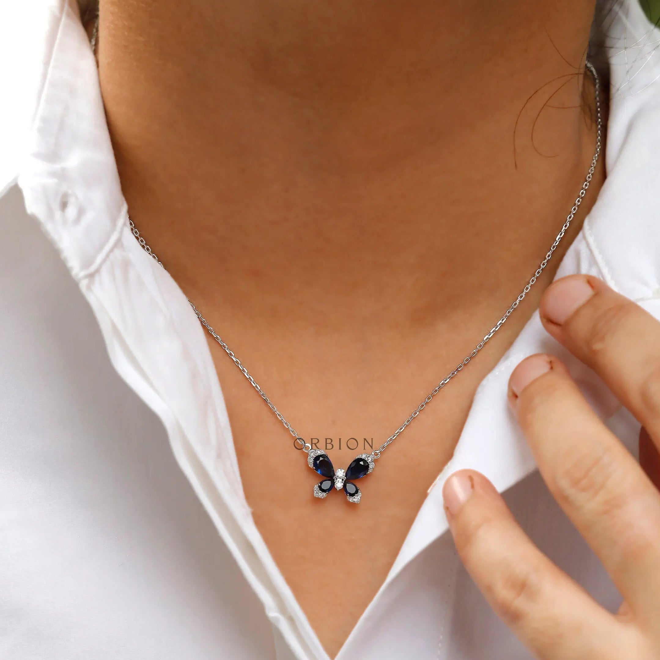 Butterfly charm necklace with sparkling diamond accents